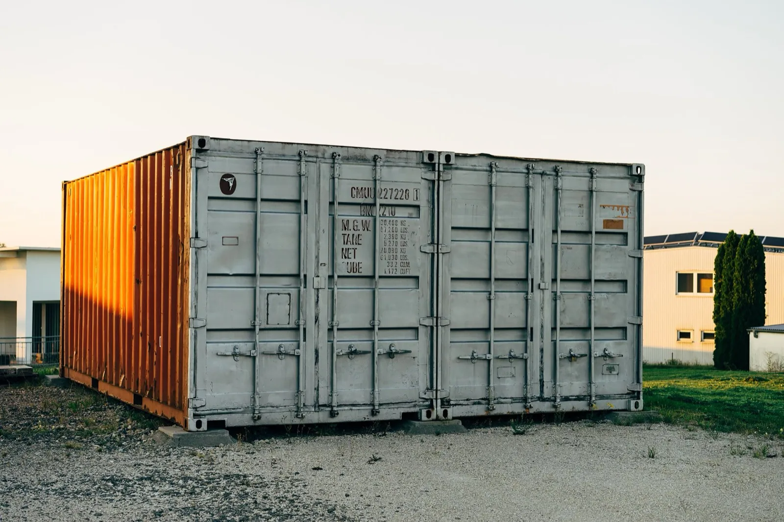 Two portable storage containers in warm golden-hour light